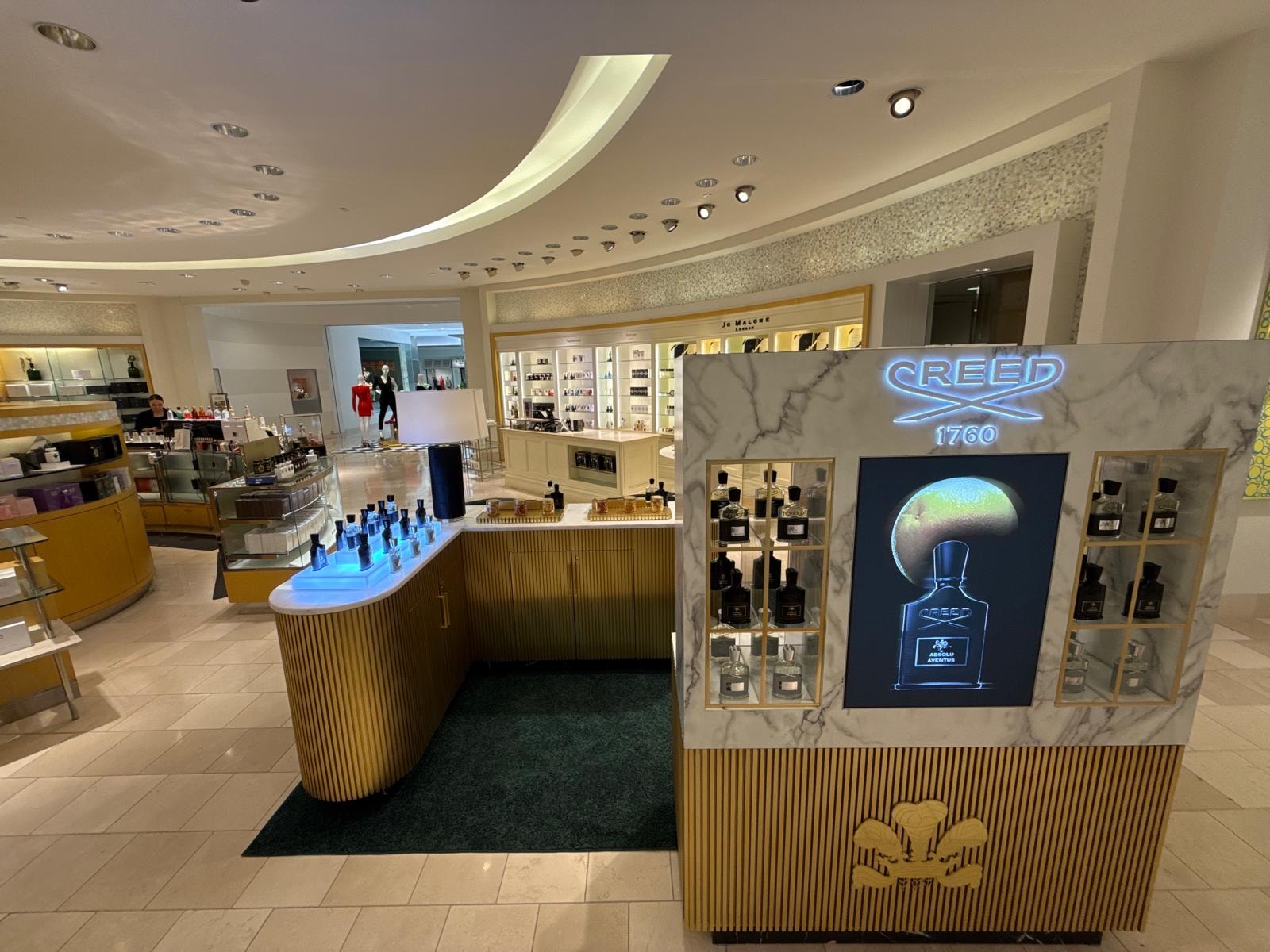 Full environment view of Creed 1760 counter installation in department store