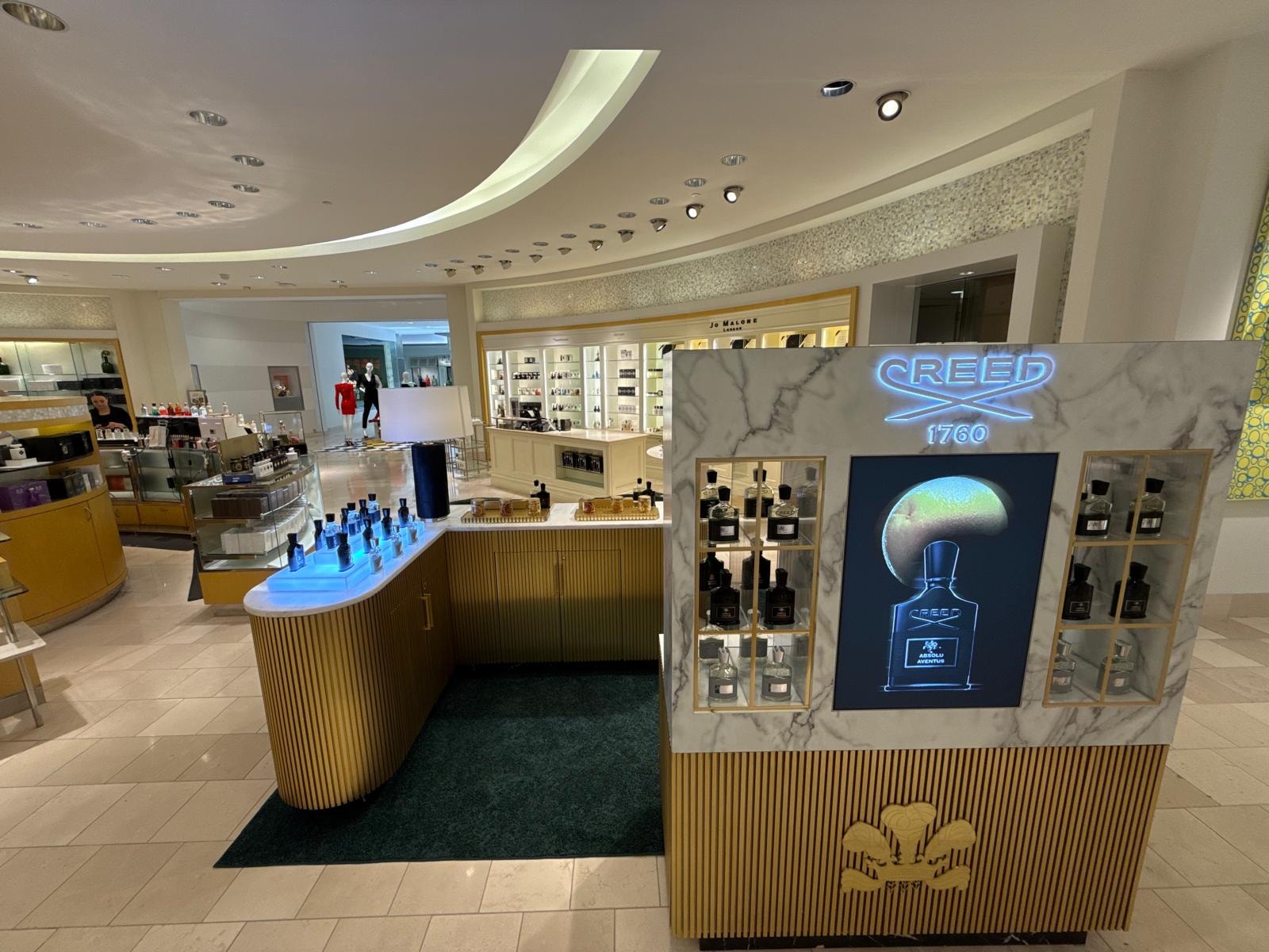 Wide angle view of Creed 1760 retail environment in luxury department store