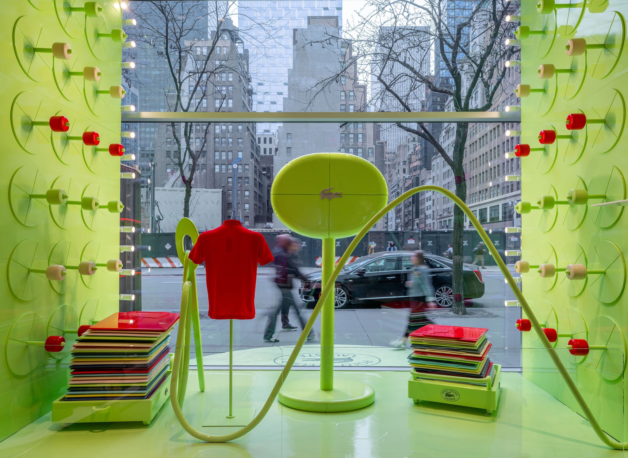 Lacoste polo wall yellow window display